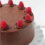 Chocolate Cake decorated with Red Cherries. Surprise delivery all over Kerala
